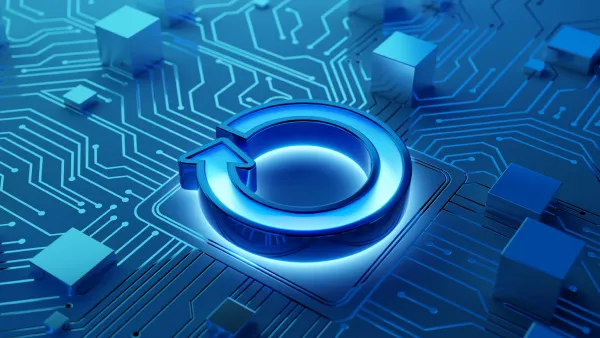 A graphic showing a glowing blue torus on a blue background with circuitry
