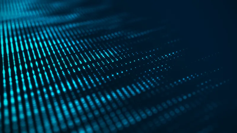 A graphic of lines of green-blue beads of light in waves reminiscent a chart of numbers or beads on an abacus