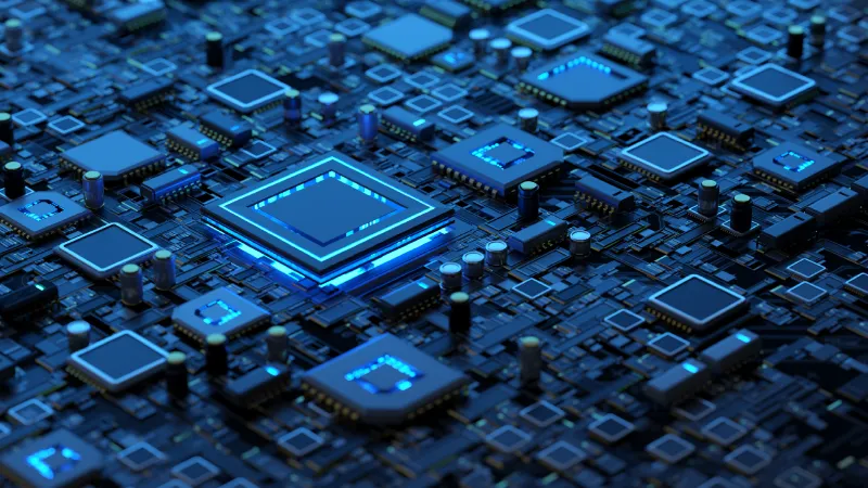A highly detailed picture of a modern circuit board lit with blue led lights