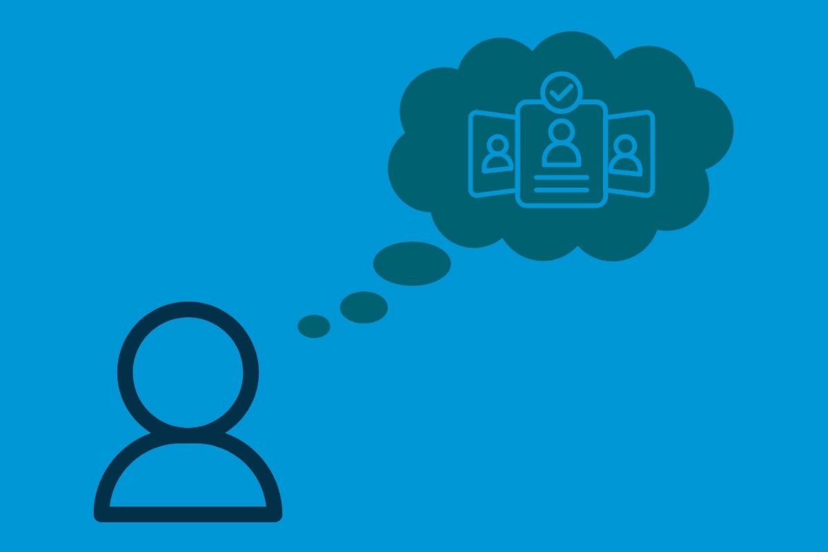 An icon of a person with a thought bubble that contains an icon of three cards with people on them. The card in the center has a checkmark at the top