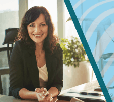 Woman CEO smiling at desk